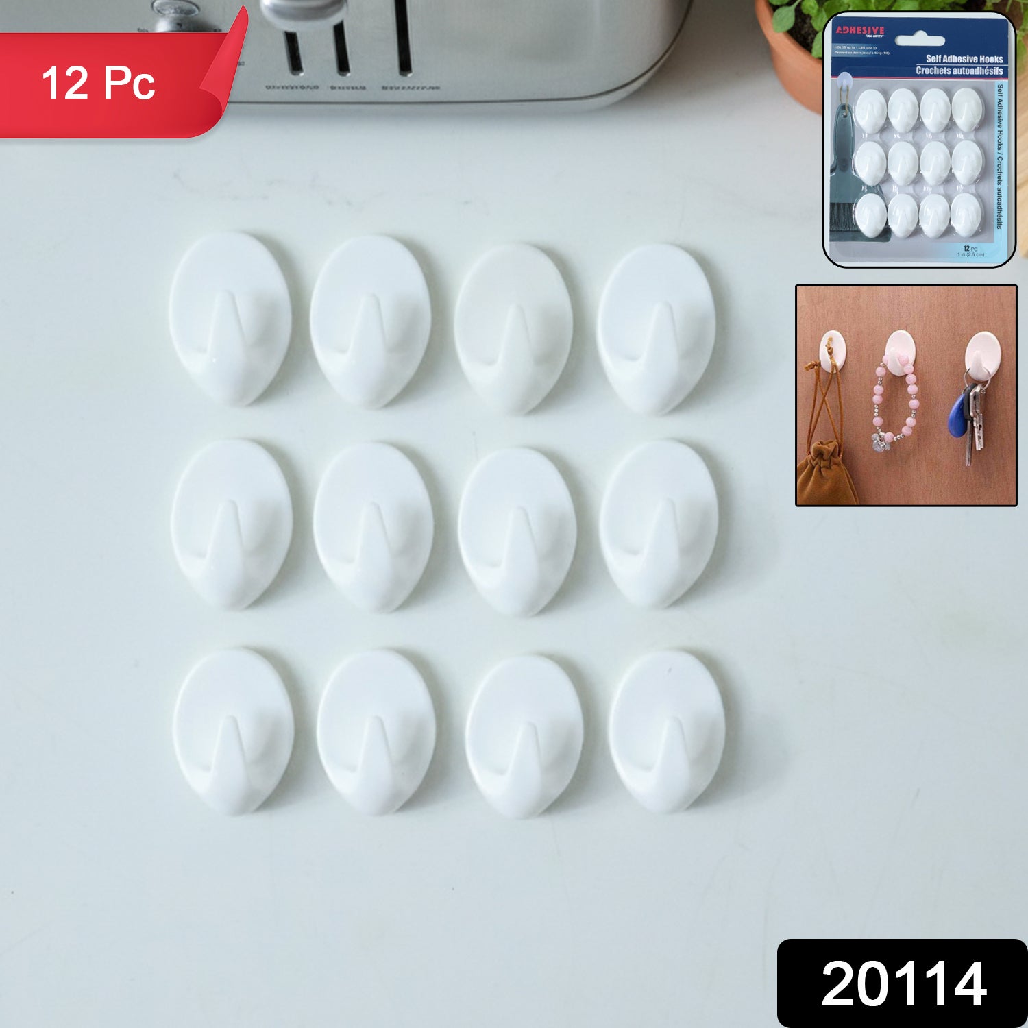 Set of strong self adhesive hooks on kitchen wall hanging towels