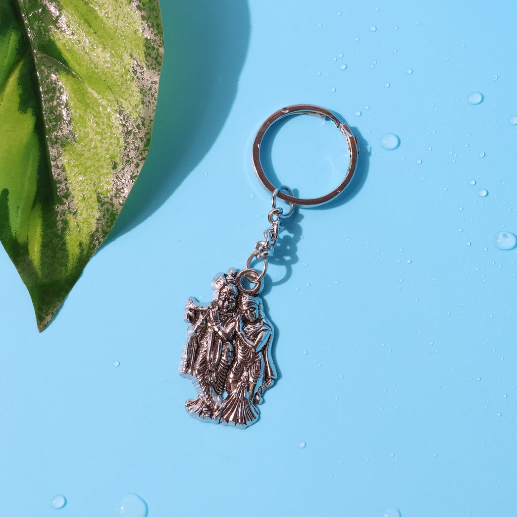 Side view of Radha Krishna metal keychain highlighting thickness and design