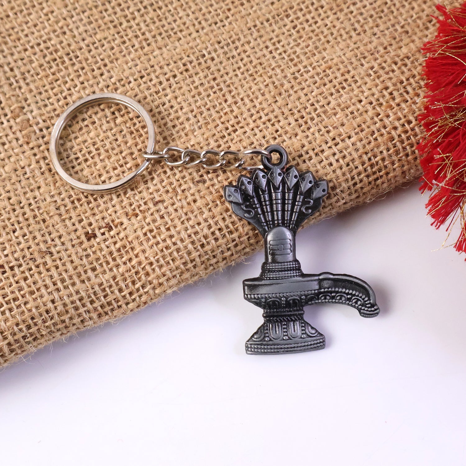 Premium metal Shiva Lingam keychain showing detailed Naag design