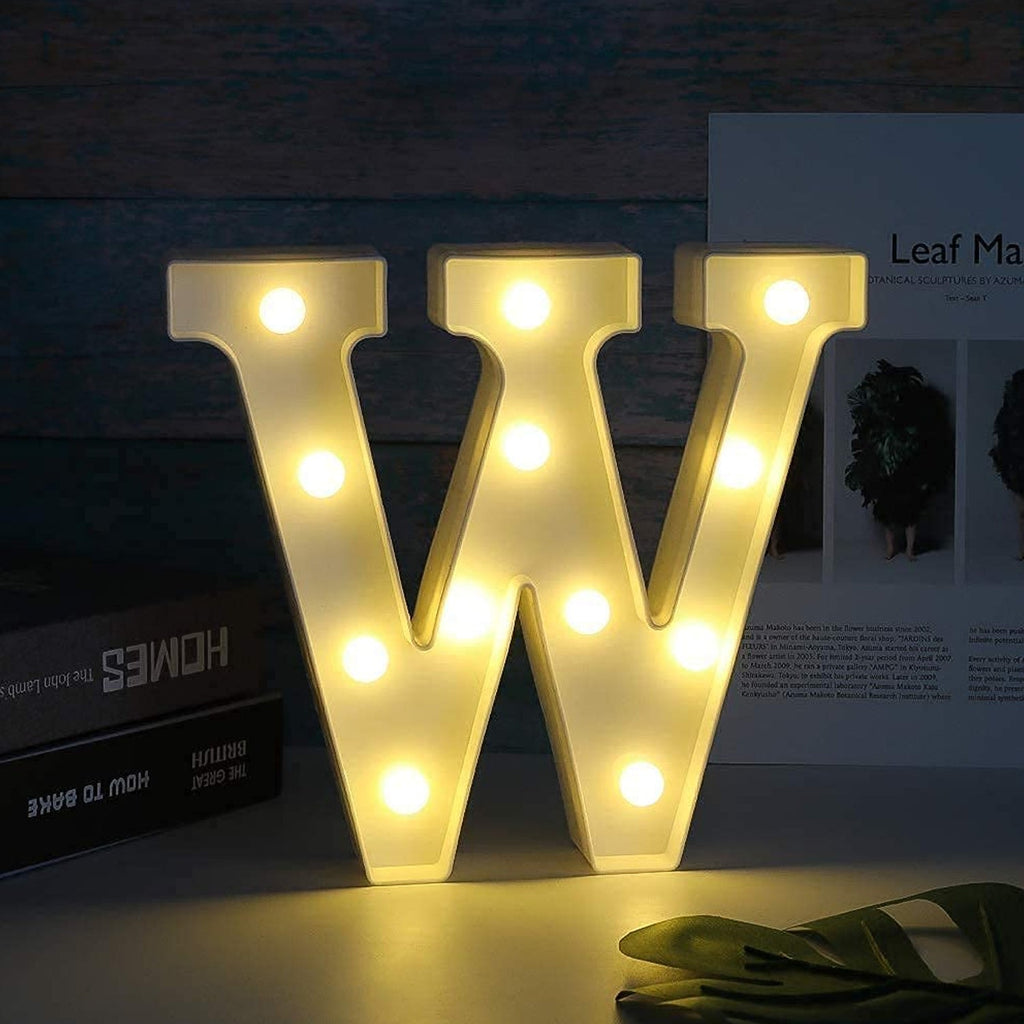 W shaped LED decorative night light emitting warm glow on table