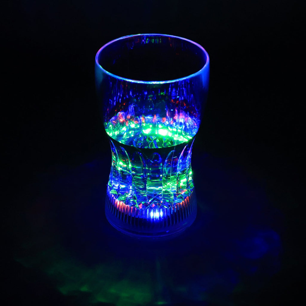 LED Light Glass illuminating a beverage with vibrant colors in a dark setting.