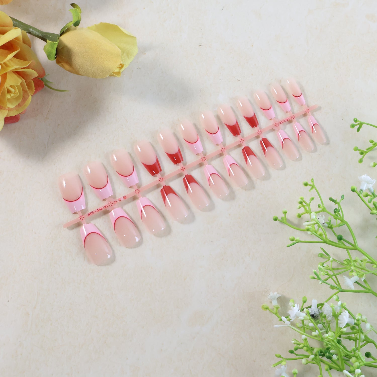 Elegant nude glossy artificial nail tips laid out in set