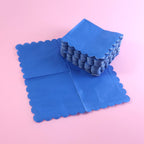 Royal scalloped paper napkin with elegant scalloped edges on party table