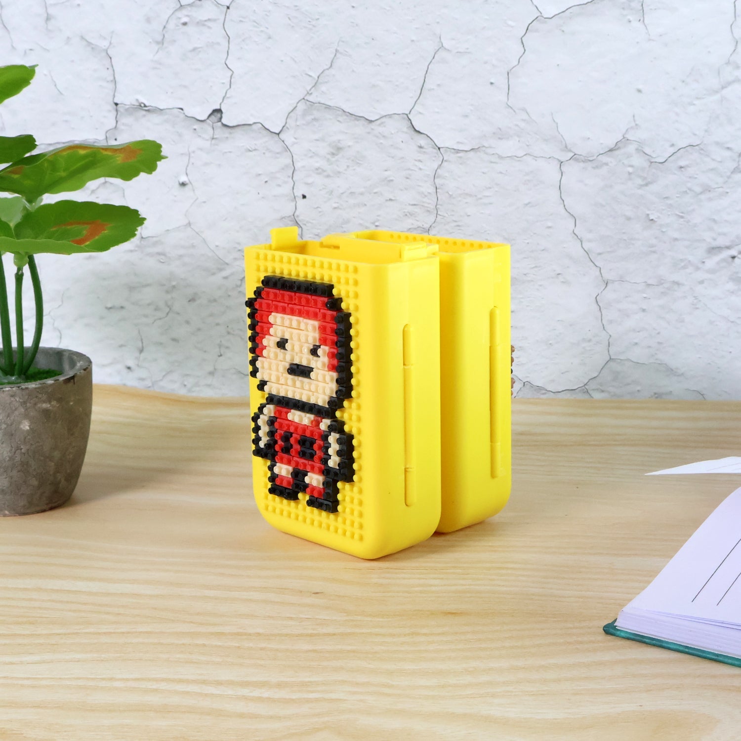 Colourful DIY Pixel Art Pen Stand with building blocks on a vibrant background.