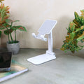 Foldable adjustable desktop mobile stand holding a smartphone securely