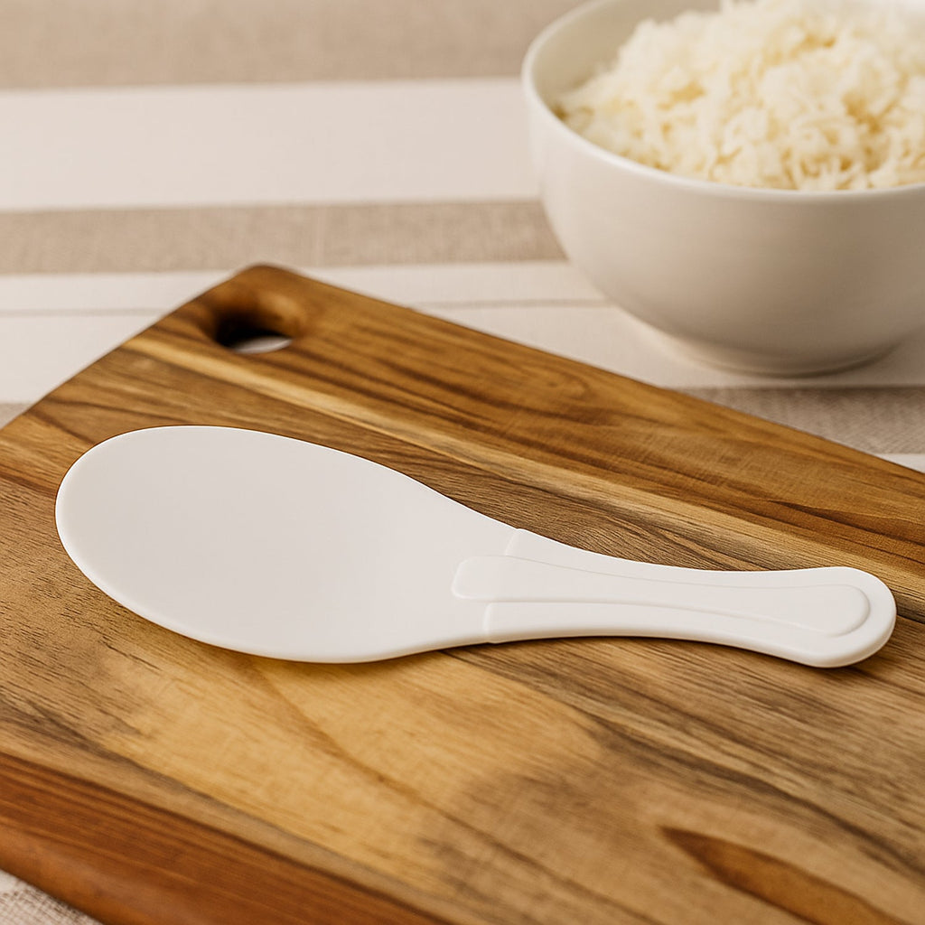 White non-stick rice serving paddle with smooth ergonomic handle