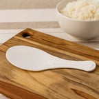 White non-stick rice serving paddle with smooth ergonomic handle