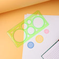 Spirograph geometry design ruler with circular tracks and stencil shapes