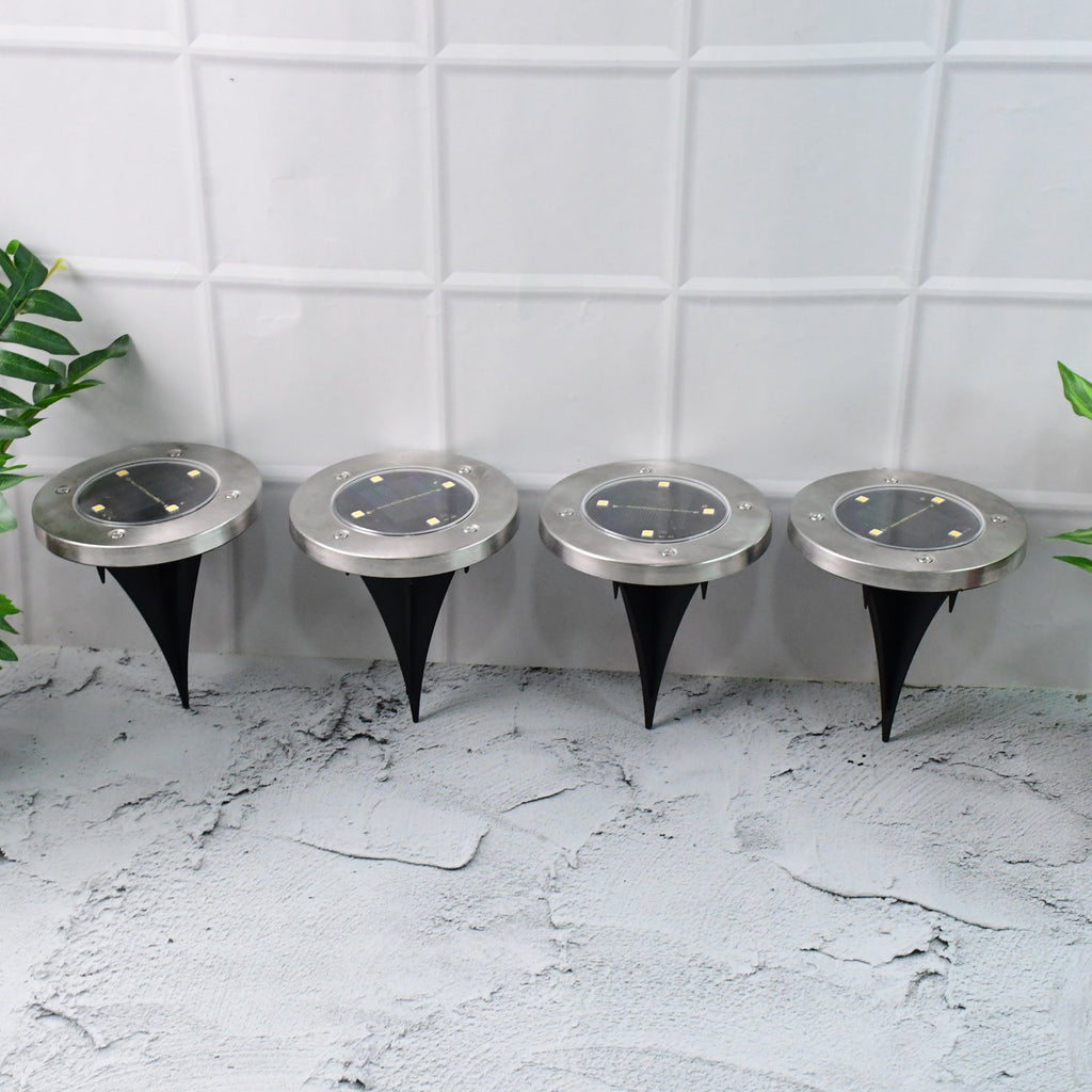 Set of 4 solar powered LED garden lights with stainless steel body and ground spikes