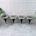 Set of 4 solar powered LED garden lights with stainless steel body and ground spikes