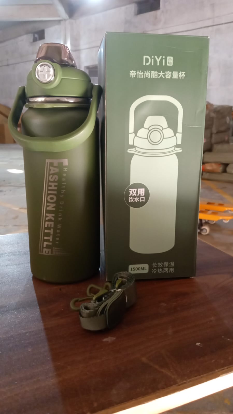 A vibrant insulated water bottle placed amidst gym and fitness equipment, ready for use.