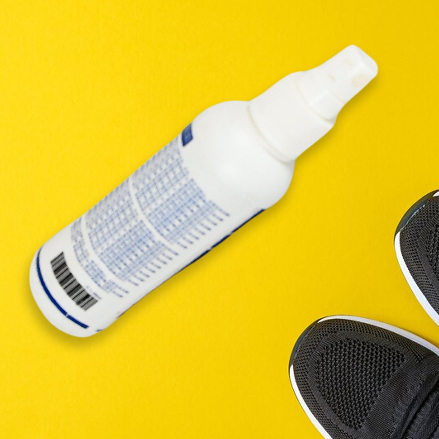 Shoe Deodorizer Spray bottle with clean socks and white sneakers.