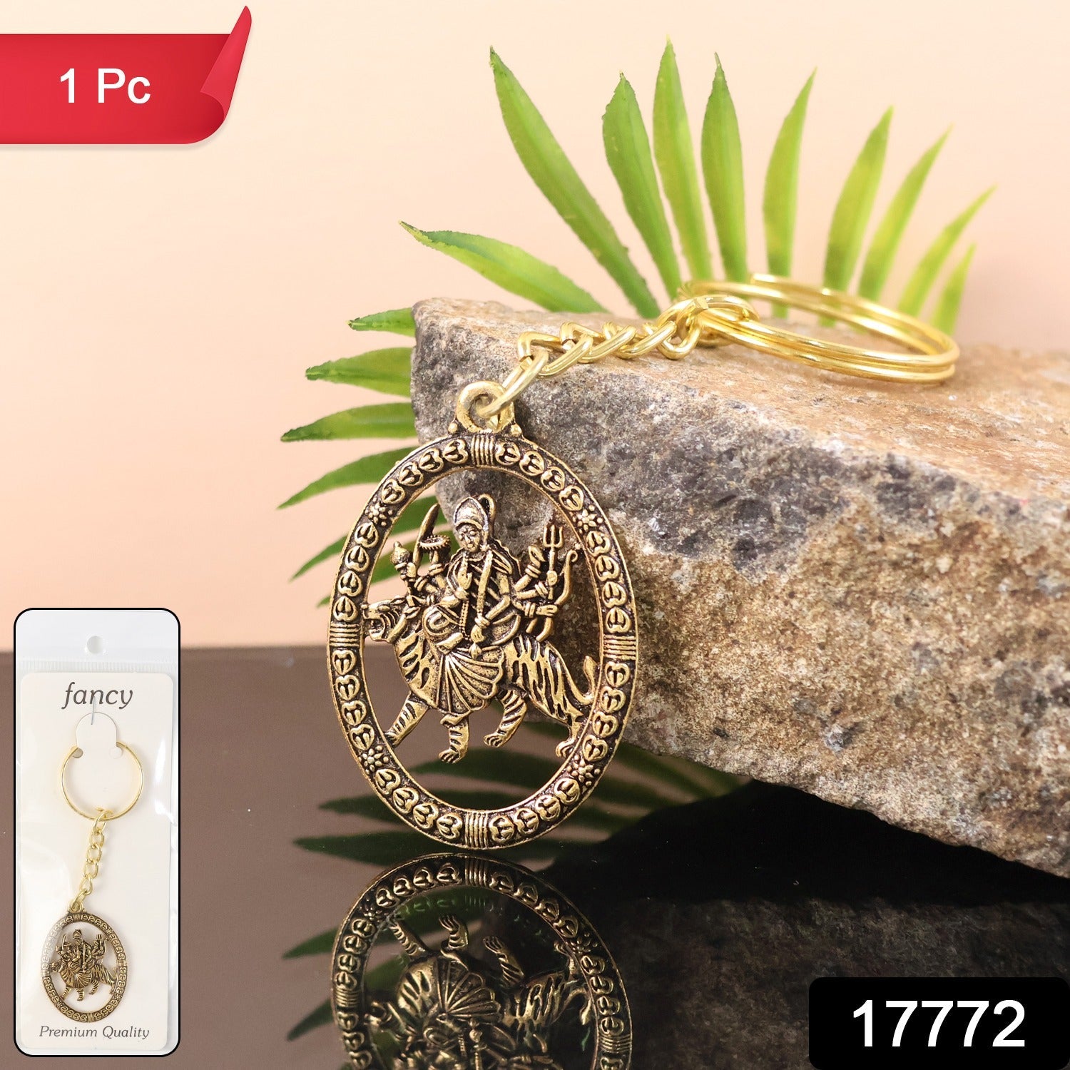 Close-up of Durga Maa Keychain with intricate golden oval frame design