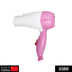 Compact foldable hair dryer with two speed control settings.