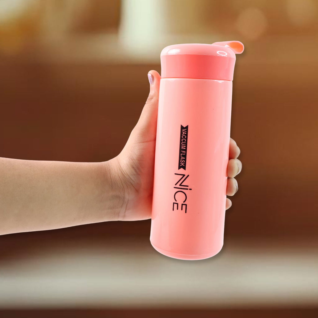 Close up of pink plastic water bottle showing screw lid details