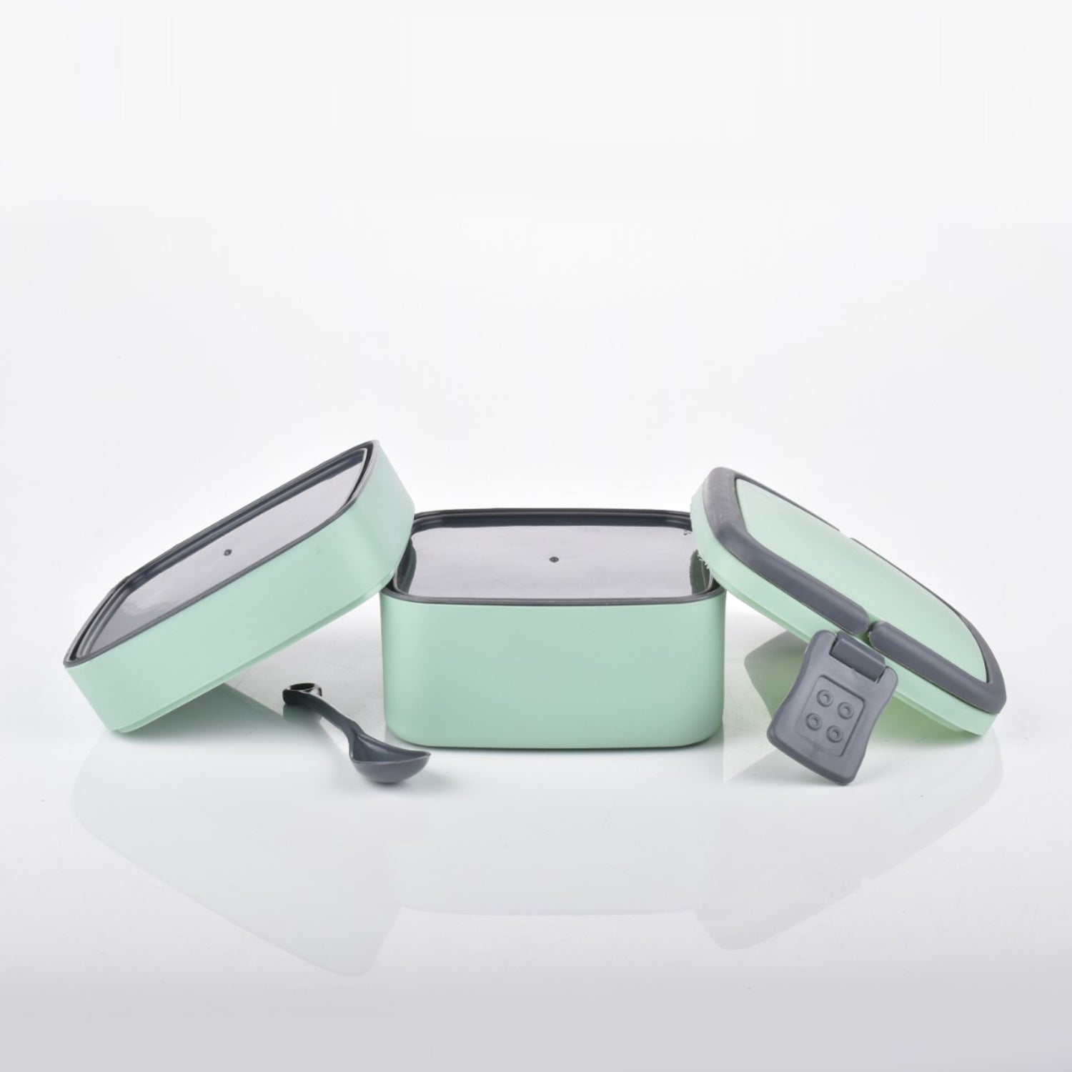 Compact green stackable lunch box, ideal for school or office.