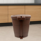 Side view of a white mini pedal dustbin, highlighting its convenient foot pedal.