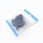 Two vibrant leaf-shaped PVC bath mats, one blue and one pink, ready for use.