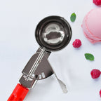Quick-release lever ice cream scoop for clean dessert portions