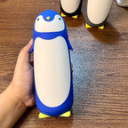 Blue and black penguin water bottle with cartoon design side view