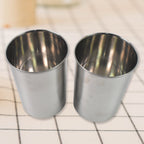 Konvex stainless steel storage containers with transparent lids, ideal for kitchen organization.