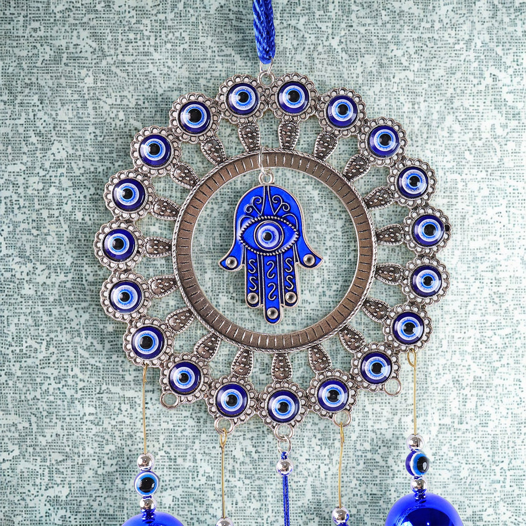 Close-up of detailed alloy and glass beadwork on Om Evil Eye chime