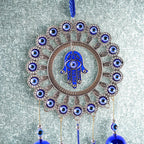 Close-up of detailed alloy and glass beadwork on Om Evil Eye chime