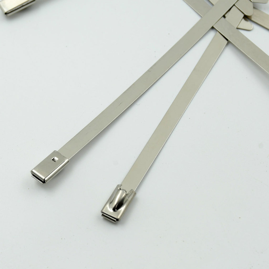 Durable stainless steel cable tie securing electrical wiring in an industrial setting.