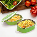 Insulated stainless steel lunch box with its lid off, showing the interior compartments.