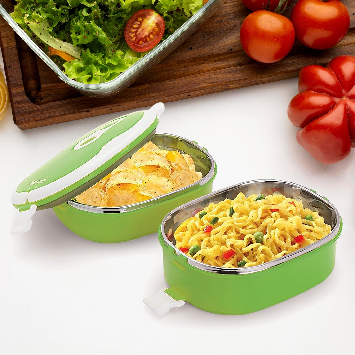 Insulated stainless steel lunch box with its lid off, showing the interior compartments.