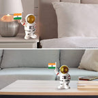 Compact solar powered astronaut figurine waving Indian flag for car interior