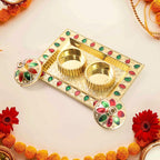 Plastic kumkum holder within the thali, ready for haldi and kumkum application.