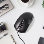 Top-down view of the black wired optical mouse, showcasing its simple and functional layout.