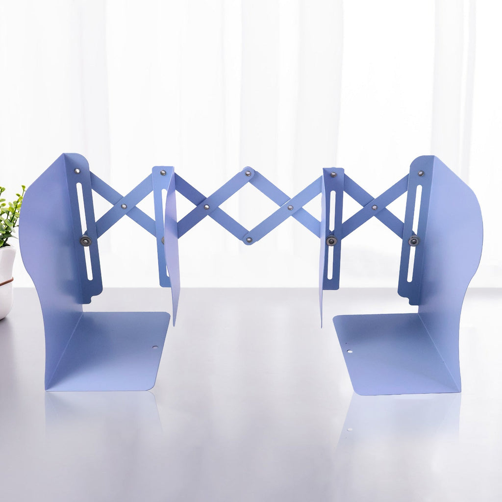 Heavy-duty metal book holder with scissor mechanism in study setting