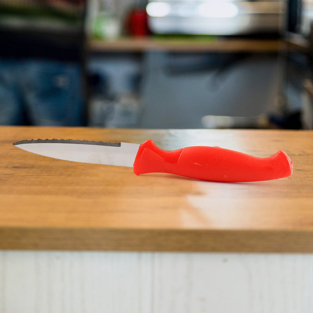 Close-up of stainless steel serrated blade for vegetable cutting