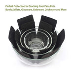 Pots and pans stacked with felt protectors between to avoid scratches and damage