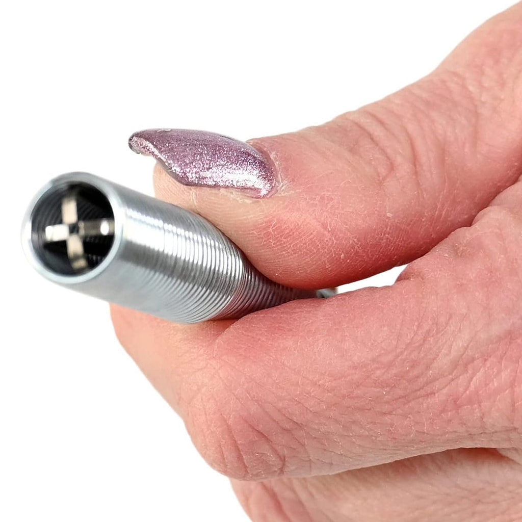 The claw mechanism of the Drain Cleaner Tool gripping a clump of hair and debris.
