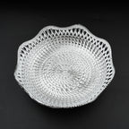 An empty round plastic tray showcasing its traditional design.