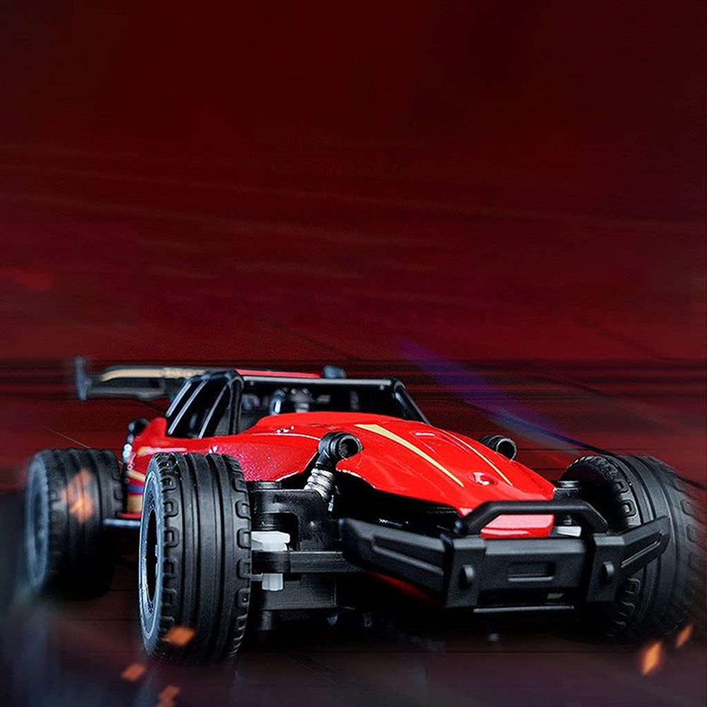 Side profile of red off-road remote control car with rugged tires