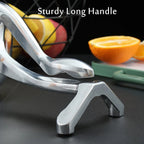 Close-up of the durable aluminium manual fruit juicer's pressing mechanism.