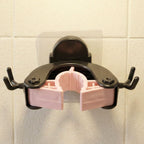 Broom secured on antler style wall mounted holder