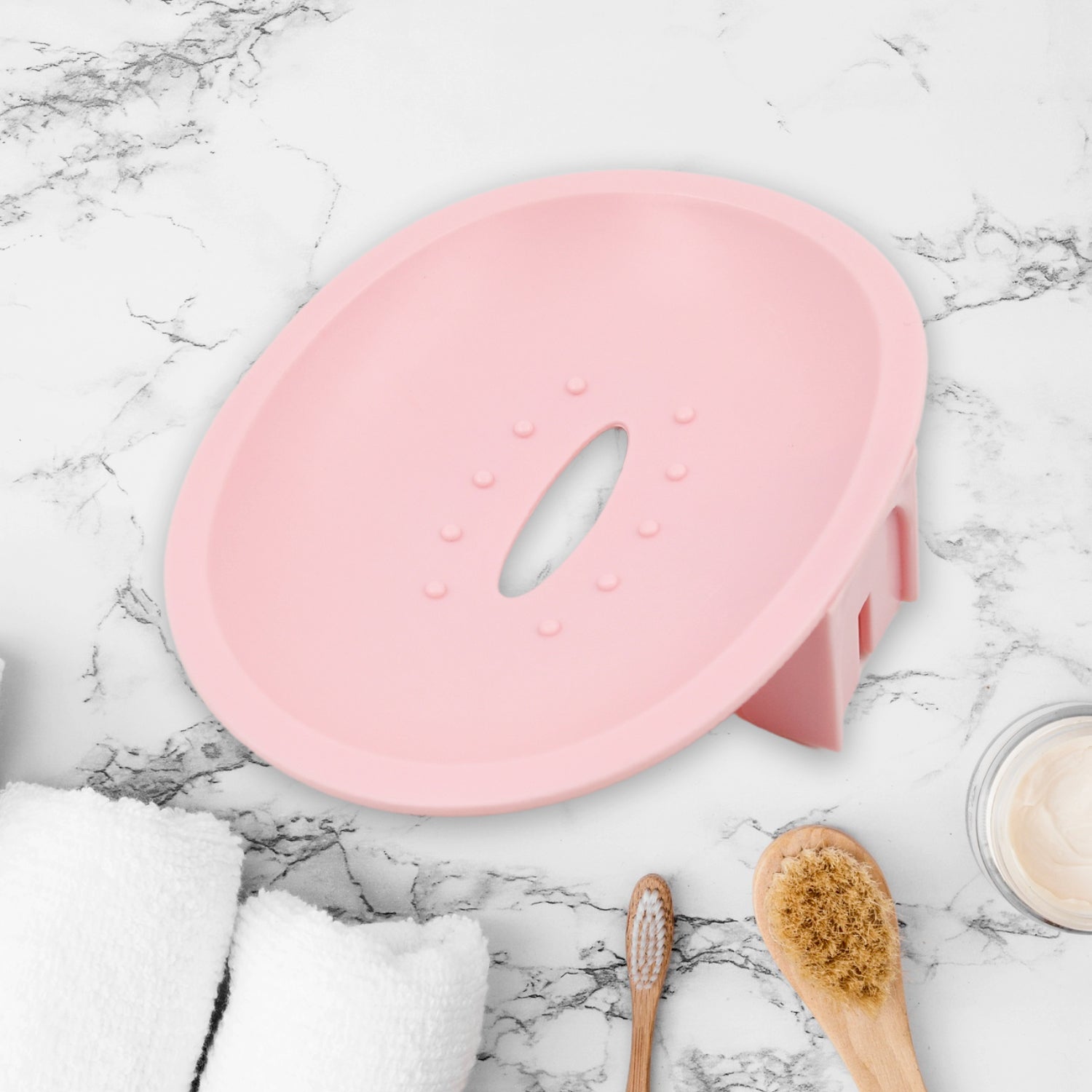 Close-up of the drainage design on the plastic wall mounted soap holder.