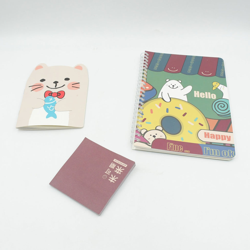 Open cartoon-themed school box displaying a diary, pen, sharpener, and stickers.