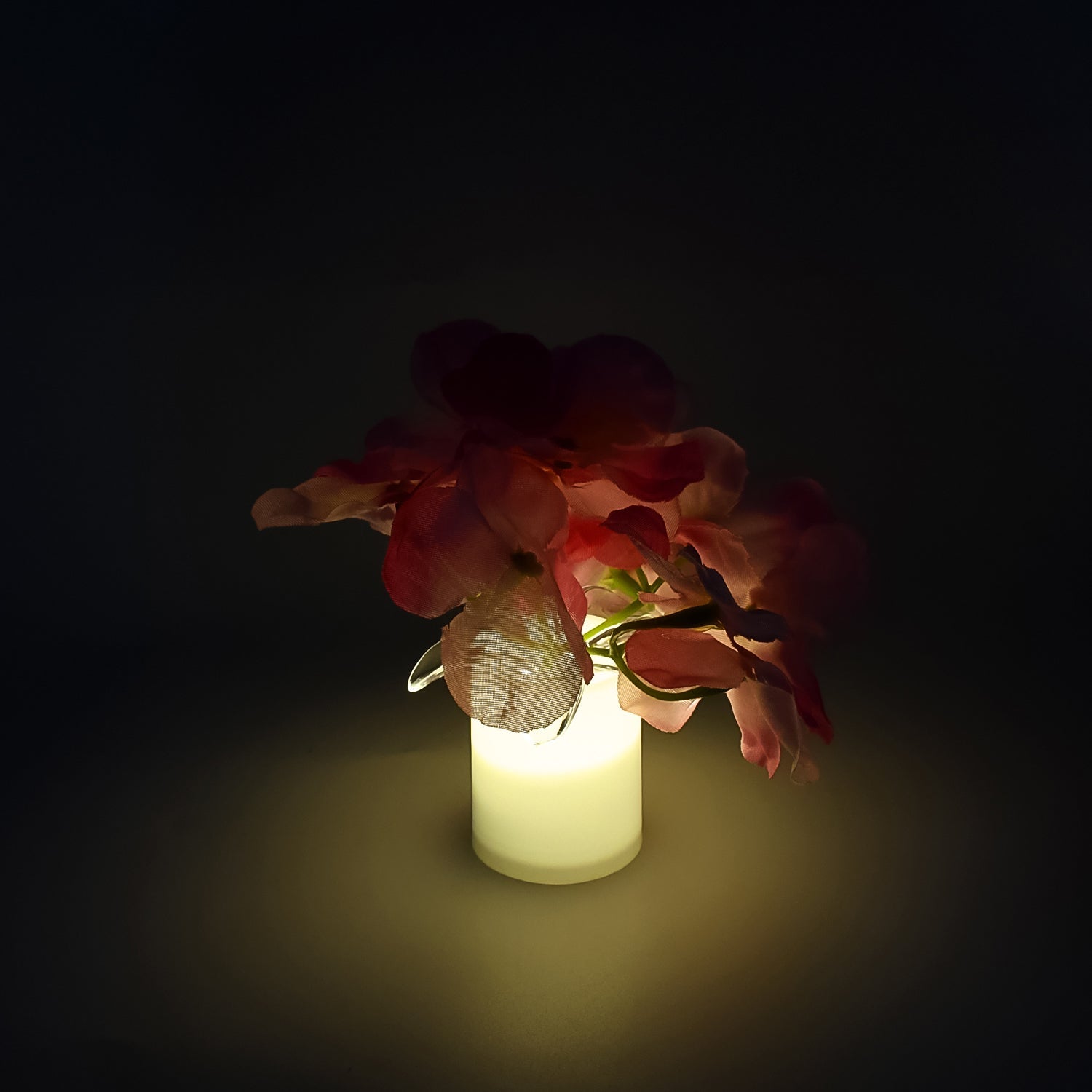 One LED mood light glowing softly on a bedside table, perfect for bedroom lighting.