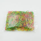 Assorted flexible elastic bands in a pile, perfect for stationery and school use.