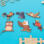 Detailed view of the various wooden bird-shaped puzzle pieces from the educational board.