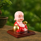 Packaging for the Solar Buddha Car Ornament, detailing product features and dimensions.
