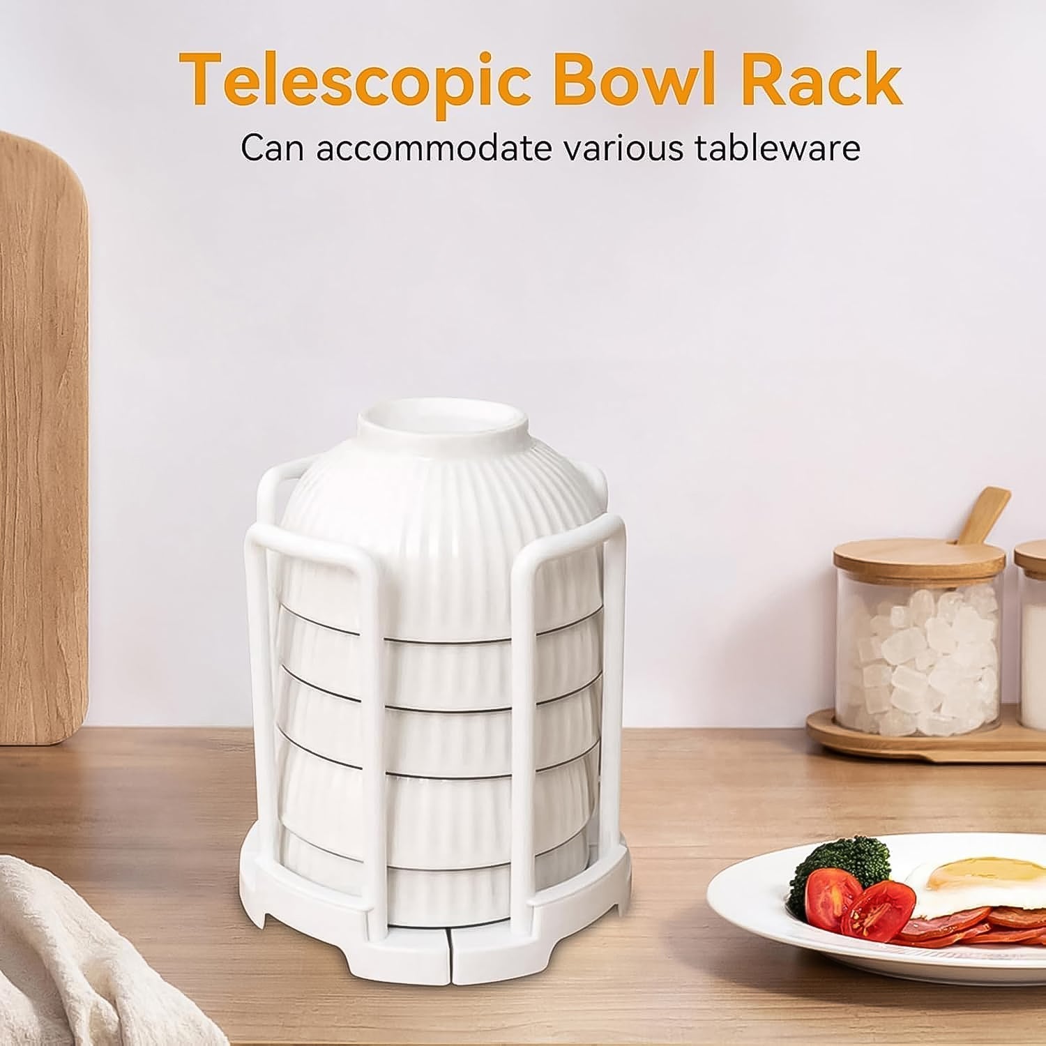 Close-up of the plastic kitchen bowl rack with air-drying dishes, showing drainage design.