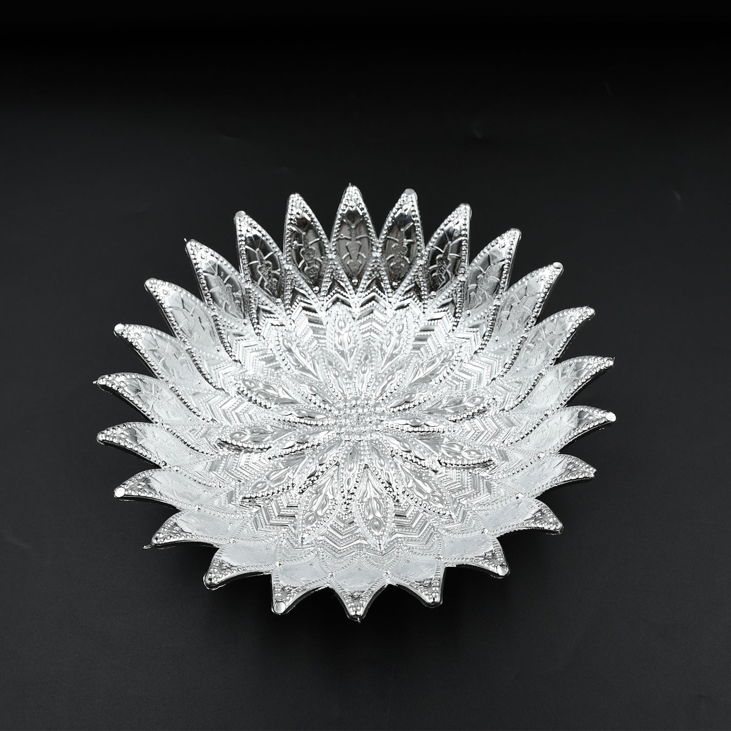 Multipurpose silver finish tray showcasing dry fruits, ideal for festive gatherings.