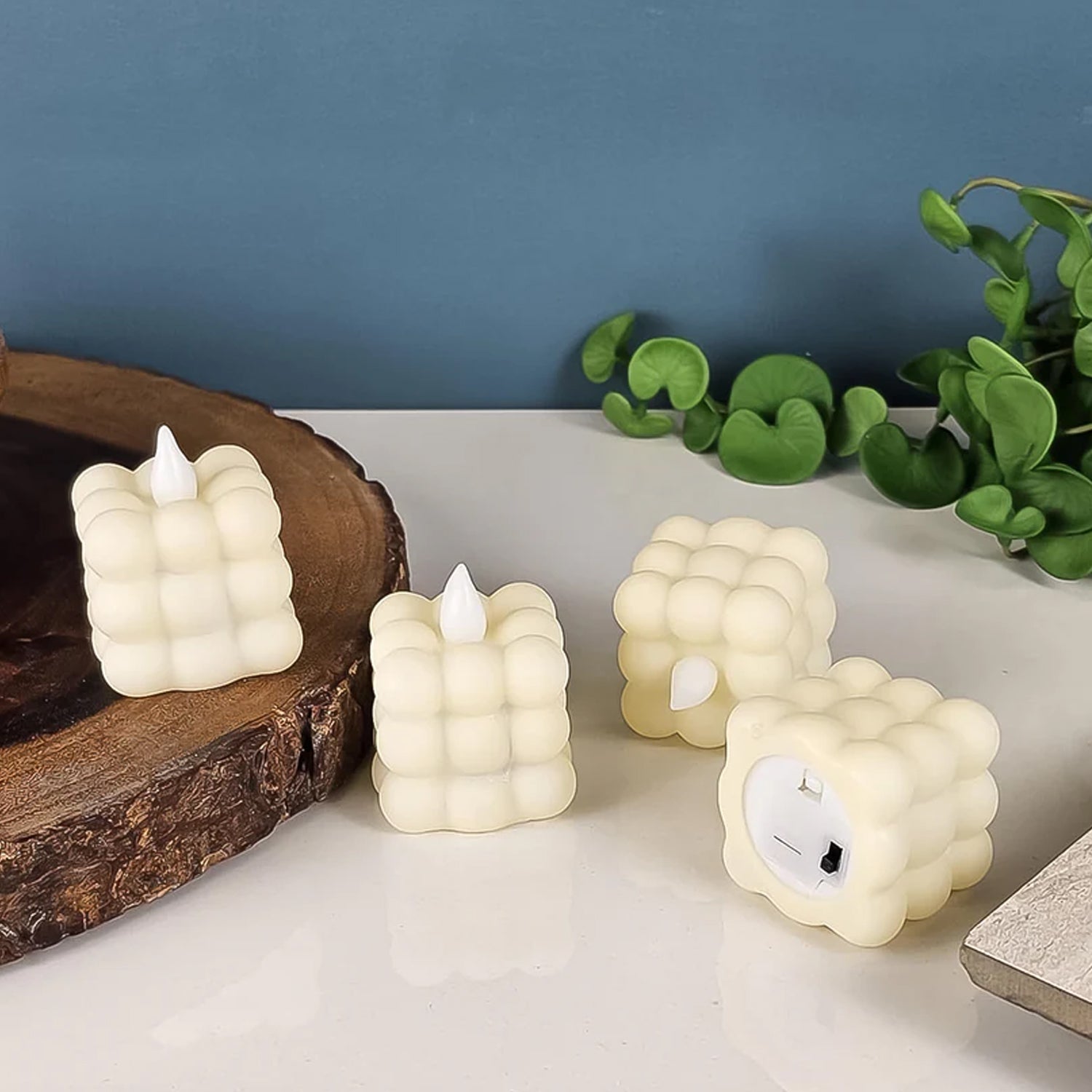 Stylish bubbled LED decorative candle glowing warmly indoors